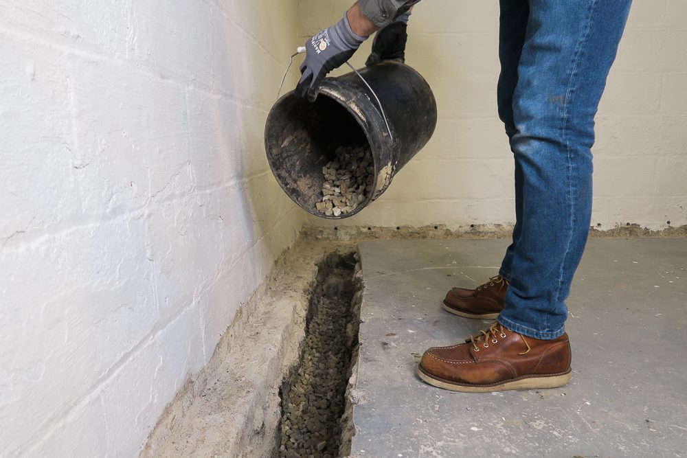 Installing-Contractor-Basement-Waterproofing1000px-Systems-7016 Filling basement trench with gravel
