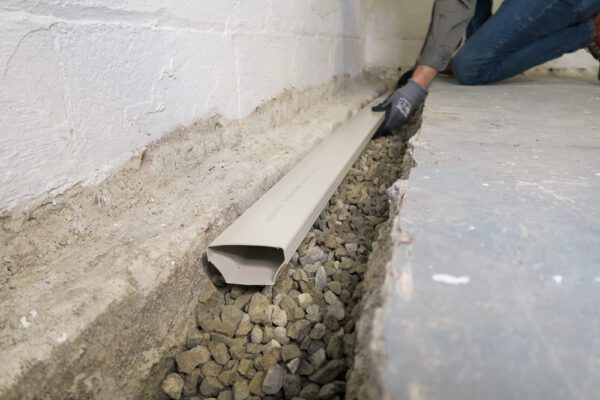 Basement waterproofing drain tile system - fast track
