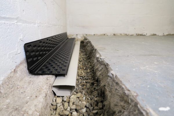 Basement waterproofing drain tile system - fast track